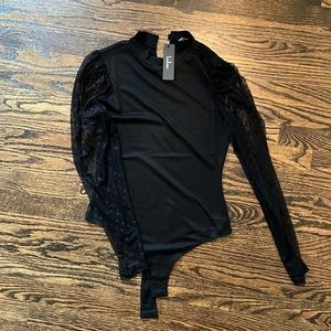 Black body suit with mesh dotted sleeves